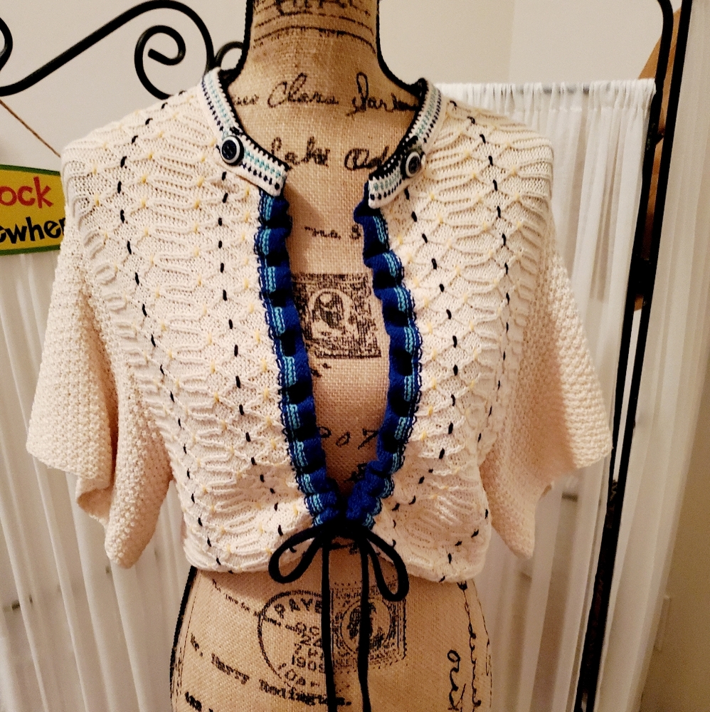 Gorgeous sweater ties in the front